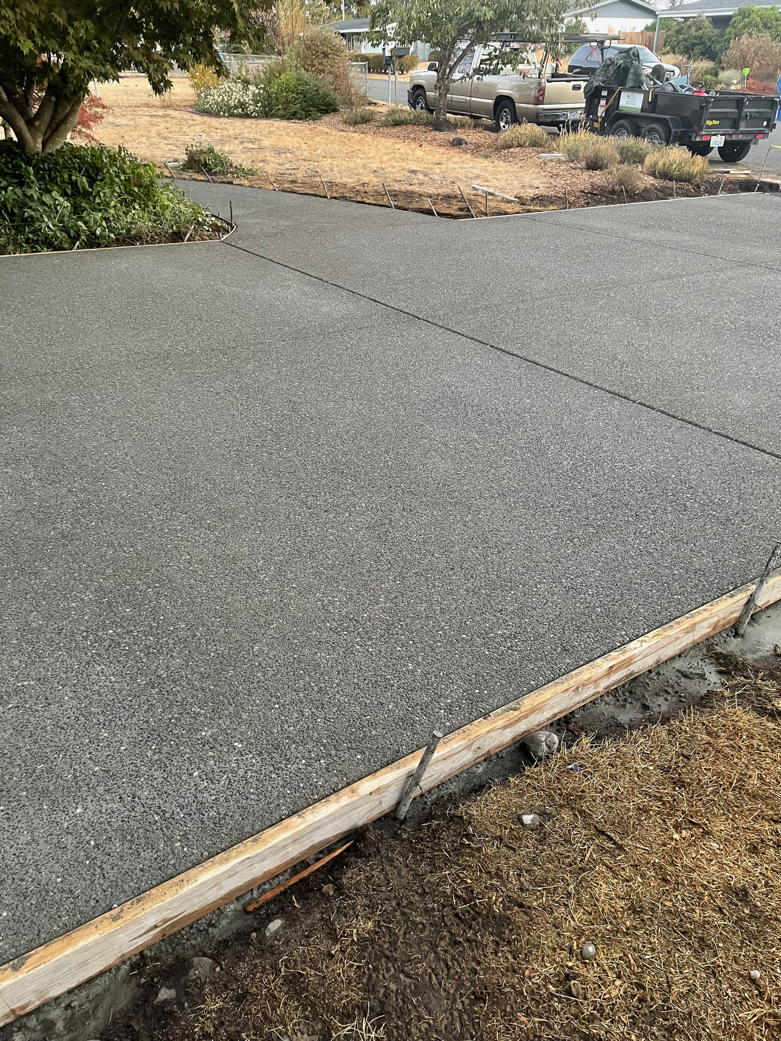 Concrete walkways that make the home easier to move through and better finished from the street.